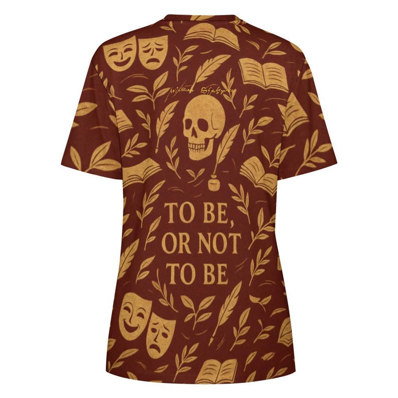 May include: A short-sleeve t-shirt in a deep reddish-brown color featuring a repeating pattern of skulls, open books, theater masks, and quill pens. The text "TO BE, OR NOT TO BE" is printed in large, bold, light-colored letters on the center front.