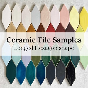 May include: Ceramic tile samples in a variety of colours and finishes, arranged in a long hexagon shape. The tiles are arranged in two rows, with the top row showing lighter colours and the bottom row showing darker colours.
