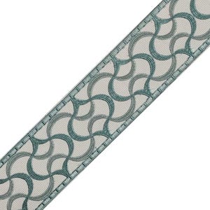 May include: Decorative ribbon with a repeating teal and gray wave pattern. The ribbon has a light cream background and a stitched border. This trim is suitable for various craft and design projects.