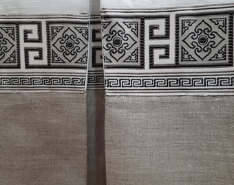 May include: White fabric with a black and gray patterned border. The border features a repeating geometric design with a Greek key motif.