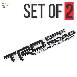 May include: A set of two black vinyl decals with the text "TRD OFF ROAD TOYOTA RACING DEVELOPMENT" in a white outline. The decals are designed for use on vehicles.
