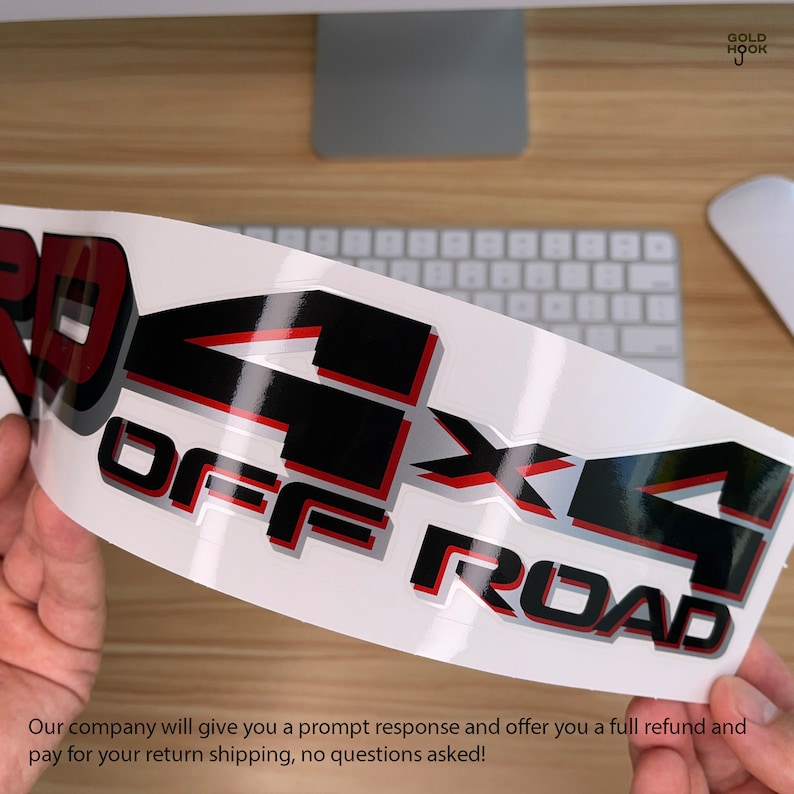 May include: A white sticker with black and red lettering that reads "4x4 OFF ROAD".