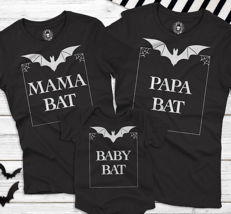 May include: Black t-shirts with a bat graphic and the text "Mama Bat", "Papa Bat", and "Baby Bat".