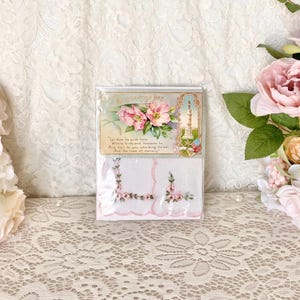 May include: Two white handkerchiefs with embroidered pink flowers and a vintage card with a pink floral design and the text "Decoration Day. Let them be quiet here, Where birds and blossoms be, And tell to you who bring the tear, And the rose of memory."