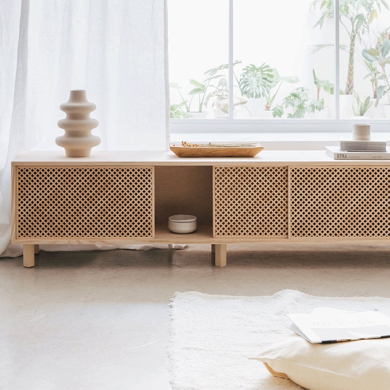 The TV stand has a choice of two or three sliding doors of our star piece, the Mediterranean lattice. Handmade by expert craftsmen.