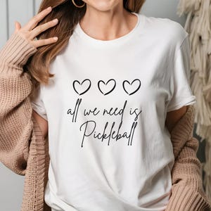 All We Need Is Pickleball Shirt, Pickleball Shirts, Pickle Ball Heart T-Shirt, Game Day T Shirt. Trendy Sports Tee Shirt