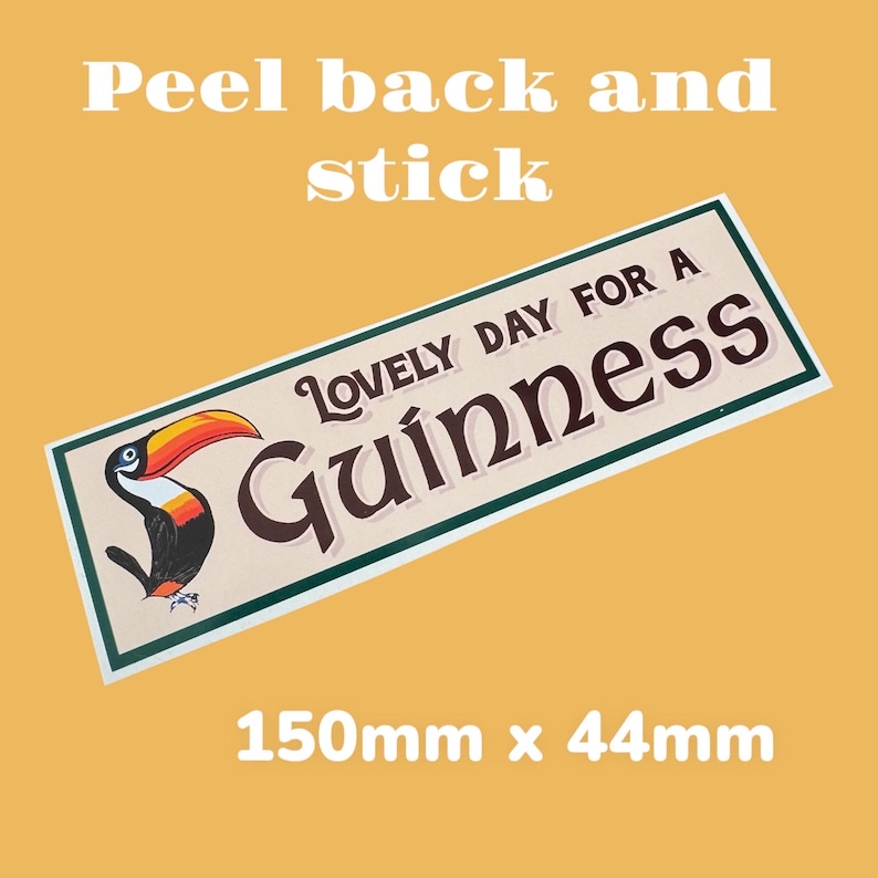 May include: A peel-and-stick sticker featuring a toucan with a green, white, and brown background. The sticker reads "Lovely Day For A Guinness" and measures 5.9 inches by 1.7 inches.