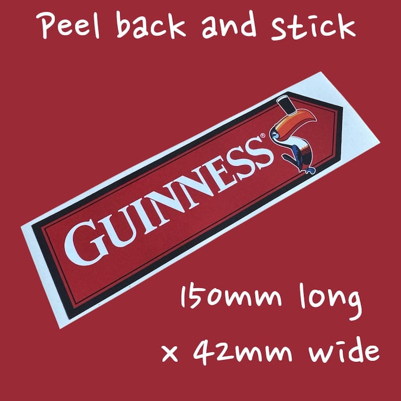 May include: A red and white Guinness sticker with a toucan logo. The sticker is 150mm long and 42mm wide. The text "Peel back and stick" is at the top.