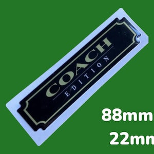 May include: Black and gold Coach Edition label with a white background. The label is 88mm x 22mm.