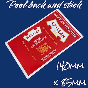 May include: Red and yellow vintage Nestle's Milk Chocolate wrapper sticker. The sticker is 5.5 inches by 3.3 inches and says "Peel back and stick".