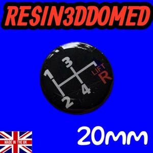May include: A black and white resin domed gear shift knob with the numbers 1, 2, 3, 4, and R, and the word "LIFT" in red. The text "RESIN3DDOMED" is in red. The knob is 20mm in diameter.