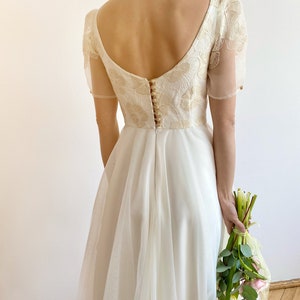 Open back romantic wedding dress, fairy ivory lace, short ethereal sleeve, unique button back, tulle princess skirt, elopement spring