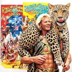 May include: A man with long blonde hair smiles while holding a leopard on his shoulders. The leopard has its tongue out. Two Ringling Bros. and Barnum & Bailey Circus posters are in the background, one red and one yellow.