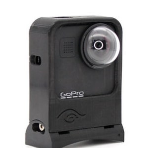May include: A black GoPro camera with a rounded lens and the GoPro logo. The camera has a rectangular body with a small speaker and a port on the side. The camera is designed for action and adventure.