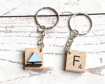 Letter tile keyring with painted blue sailboat embellishment on back - alphabet keyring perfect for small gift or favour