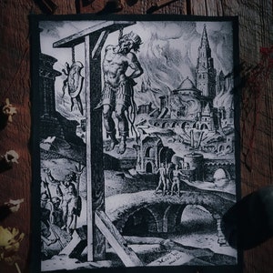 May include: Black and white patch featuring a historical engraving of a man hanging from a gallows, with a city in the background. The image includes figures, a bridge, and a burning building. The patch has a black border and is set against a wooden surface.