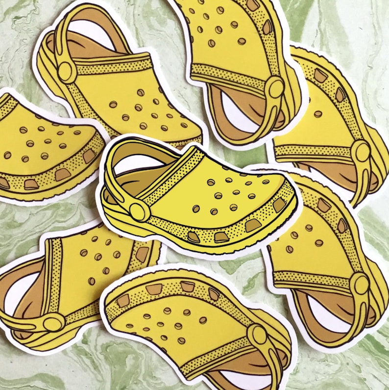 yellow crocs with stickers