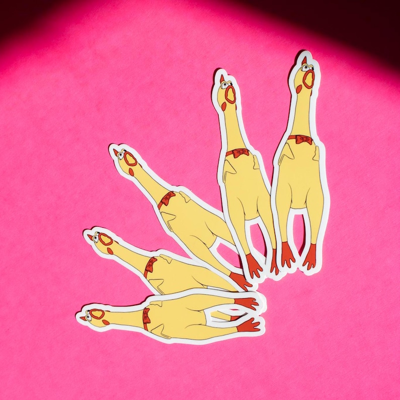 May include: Five yellow rubber chicken stickers with red bow ties. The chickens are all facing different directions and have their eyes wide open.