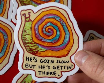He's Going Slow Snail Vinyl Sticker | Cute aesthetic motivational runner fitness workout grind laptop decal