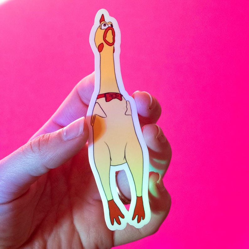 May include: A yellow rubber chicken sticker with a red bow tie and a surprised expression. The sticker is on a pink background.