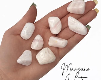 May include: A collection of eight smooth, polished Mangano Calcite stones in shades of pale pink and white. The stones have a glossy, rounded appearance with subtle internal veining. The text Mangano Calcite is printed in black in the bottom right corner.