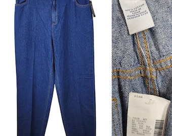 May include: Blue denim jeans hanging on a clothesline. The jeans have a classic five-pocket design and a straight leg cut. A tag with details like "100% Cotton" and size information is attached.