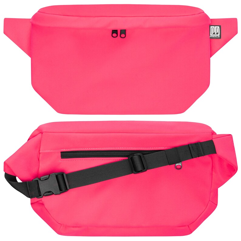 May include: A bright pink fanny pack with a black adjustable strap and a zippered pocket. The pack has a black buckle and a small black logo that says "DDP" on the front.