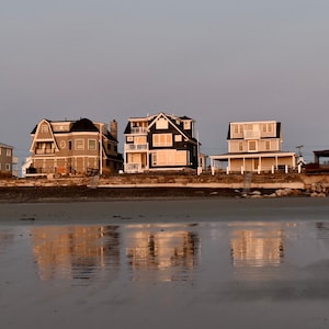 Sunrise reflections at low tide along Wells, Maine