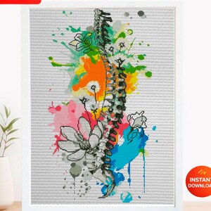 May include: A cross stitch pattern PDF featuring a vertical human spine illustration surrounded by colorful watercolor splashes in orange, pink, and blue, accented with black and white line art flowers on a light gray grid background.
