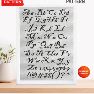May include: A framed cross-stitch pattern displaying the alphabet in a cursive style, plus numbers and symbols. The words "CROSS STITCH PATTERN" are at the top. The image includes a "PDF PATTERN" and "INSTANT DOWNLOAD" label.