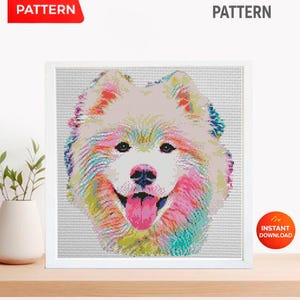 May include: A digital PDF cross stitch pattern featuring a colorful, pixelated portrait of a Samoyed dog. The dog has white fur with vibrant rainbow-colored accents, a black nose, and a pink tongue. The text PDF PATTERN and CROSS STITCH PATTERN appear.