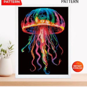 May include: A framed cross-stitch pattern of a colorful jellyfish against a black background. The jellyfish is rendered in shades of blue, green, pink, and yellow. The words "PDF Pattern" and "Instant Download" are visible. The words "Cross Stitch Pattern" are also visible.