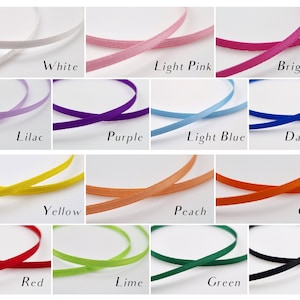 May include: A collection of colorful ribbons in various shades, including white, pink, blue, yellow, and green. Each ribbon is labeled with its color name: White, Light Pink, Bright Pink, Lilac, Purple, Light Blue, Dark Blue, Yellow, Peach, Orange, Red, Lime, Green, and Black.