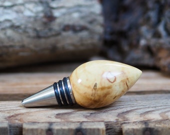 A premium bottle stopper made from a beautiful piece of spalted Chestnut and Stainless steel. Wooden bottle stopper.