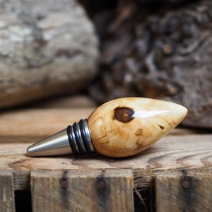 A premium bottle stopper made from a beautiful piece of spalted Chestnut and Stainless steel. Wooden bottle stopper.