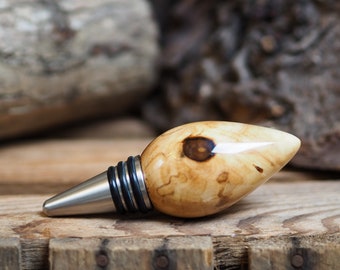 A premium bottle stopper made from a beautiful piece of spalted Chestnut and Stainless steel. Wooden bottle stopper.
