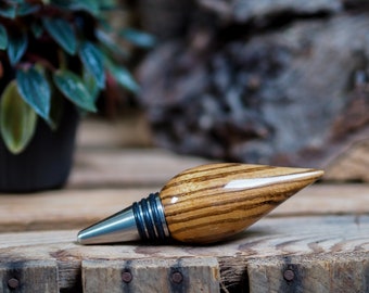 A bottle stopper made from a beautiful piece of Zebrano wood and Stainless steel.