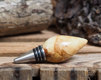 A premium bottle stopper made from a beautiful piece of spalted Chestnut and Stainless steel. Wooden bottle stopper.