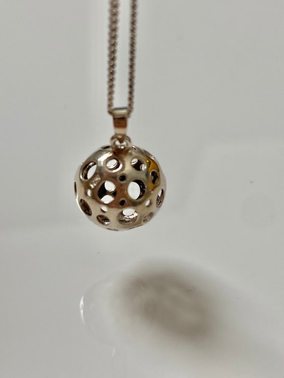 Modernist Finnish sterling silver pendant named “L