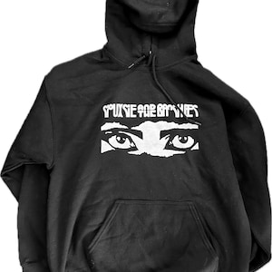 May include: Black hooded sweatshirt with a white graphic print of a pair of eyes and the text "YOU SEE FOR MILES".