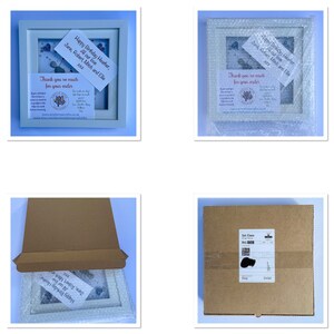 May include: A white picture frame with a blue and white floral design inside. The frame has a handwritten note that says "Happy Birthday Heather, Jane, Robert, Mitch and Ellie. All our love. XXXX. Thank you so much for your order."