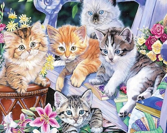 May include: A colorful illustration of five kittens in a garden setting. The kittens, in shades of orange, brown, and gray, are sitting on a bench and in a basket surrounded by flowers. The artwork has a soft, painterly style.