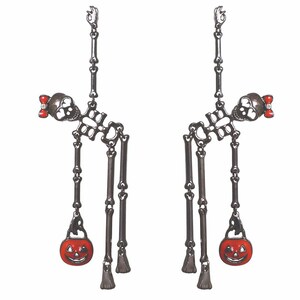 May include: A pair of Halloween-themed earrings. Each earring features a skeleton design with a skull, rib cage, and dangling bone accents. A small red bow adorns each skull. A smiling orange pumpkin charm hangs from each earring.