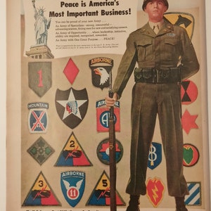 May include: A vintage poster promoting the U.S. Army with the text "Peace is America's Most Important Business!" and "Army Day-April 6". The poster features a soldier in uniform standing in front of a wall of military unit patches. The soldier is holding a rifle and is looking directly at the viewer.