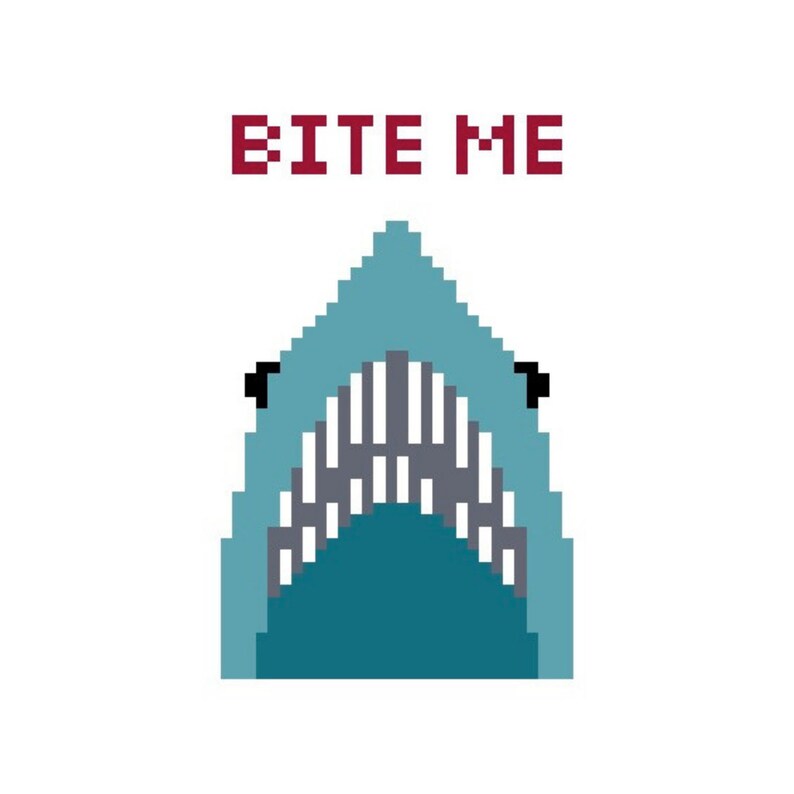 May include: Pixelated illustration of a shark's open mouth with sharp teeth. The shark is in shades of blue and teal, with the text "BITE ME" in red block letters above it. The background is white.