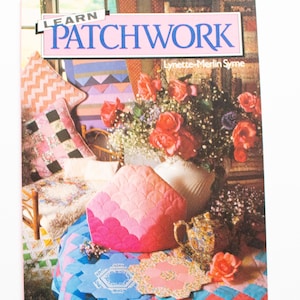 May include: A book titled "Learn Patchwork" by Lynette-Merlin Symne. The cover features a pink and white patchwork quilt with a teapot and roses.