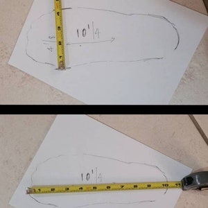 May include: A white sheet of paper with a pencil drawing of a foot outline. A yellow measuring tape is placed along the outline of the foot. The tape reads "10 1/4".