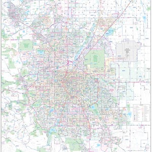 May include: Detailed map of Metro Denver, Colorado, showing roads, zip codes, and geographical features. The map features a grid pattern with various colors representing different areas. The title "Metro Denver" is displayed at the top right.