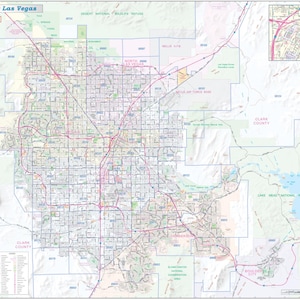 May include: A detailed map of Greater Las Vegas, featuring a grid of streets and highways in pink and red. The map includes labels for landmarks, parks, and the surrounding areas, with a small inset map in the upper right corner.