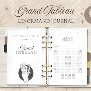 May include: Open white Lenormand journal with gold rings, featuring the text "Grand Tableau" in elegant script. The journal includes a spread with a card layout and a hand holding tarot cards. The cover is a light beige color.